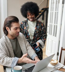 couple using laptop