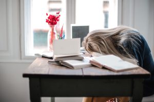 woman sleeping on table