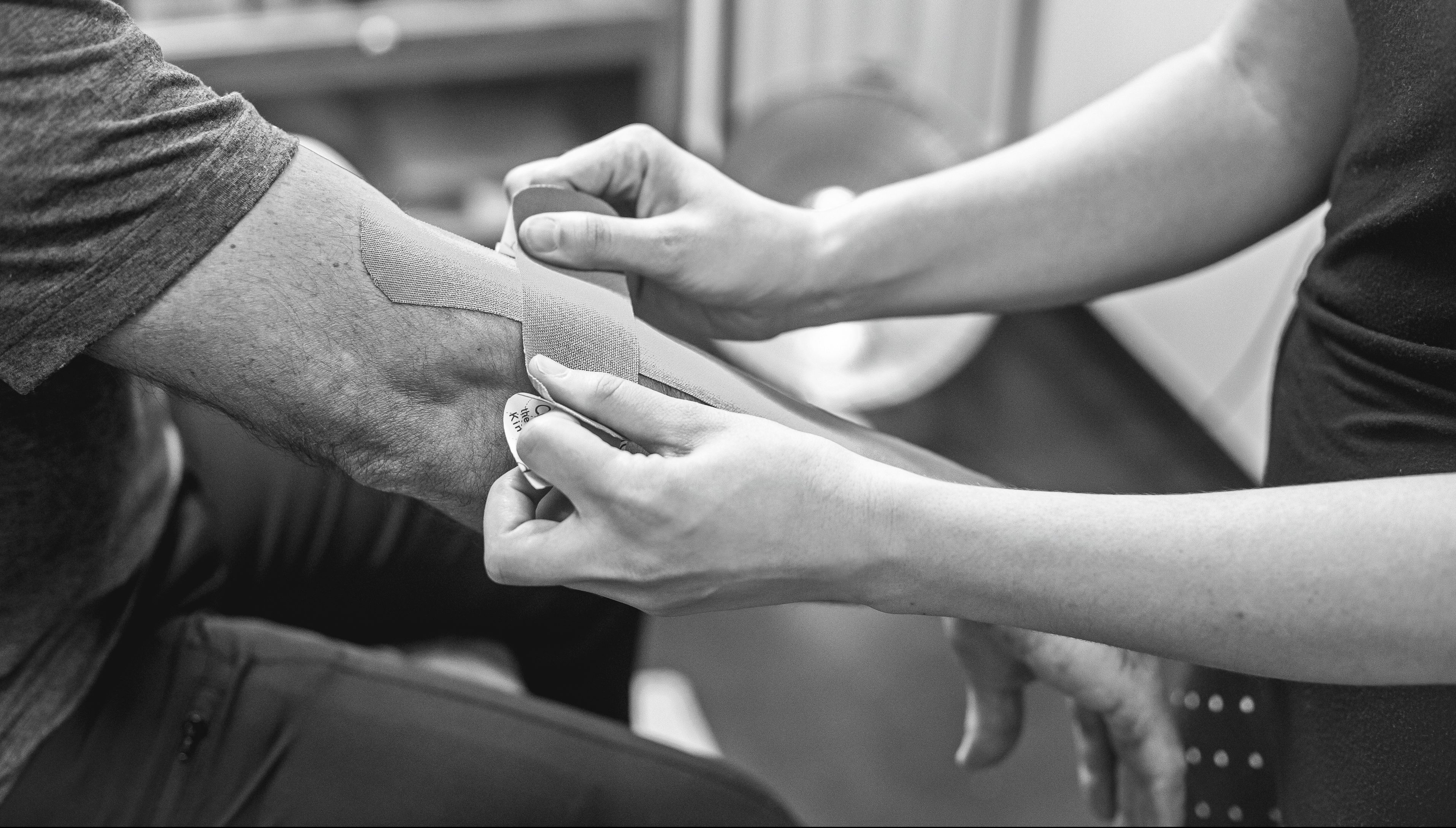 person putting on bandage