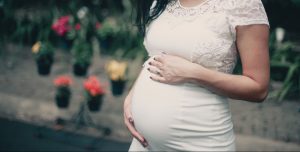 pregnant woman looking down