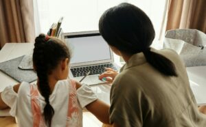 Mom helping child with homework